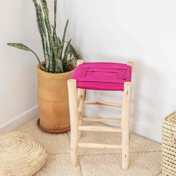Stool in raw wood and braided pink rope